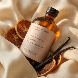 Bottle of Vanilla Blood Orange bath salt with dried oranges and vanilla beans on a beige fabric background